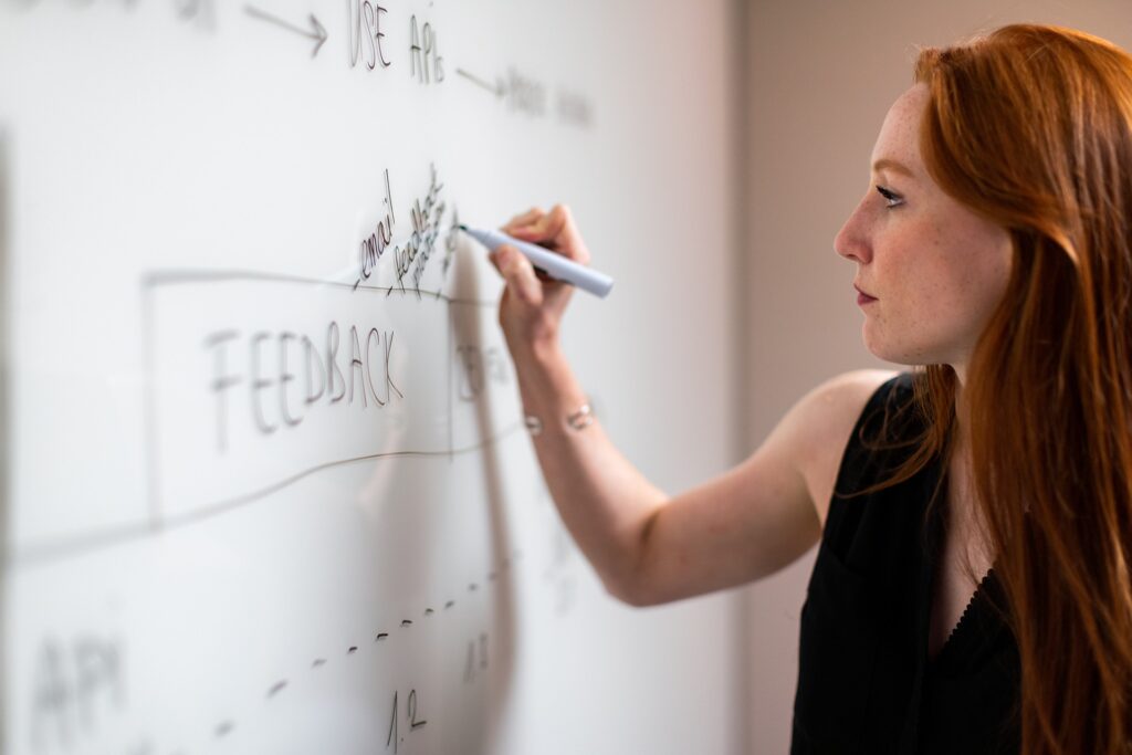 image of female at whiteboard
